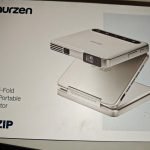 Aurzen ZIP Tri-Fold DLP Truly Mini Projector. Pocket Size. Zero-Lag Focus. One-Click Screen Mirroring. Full-Screen Mode. Type-C Fast Charging. 5.000mAh Battery. Indoor Outdoor Portable Projector.Gold photo review